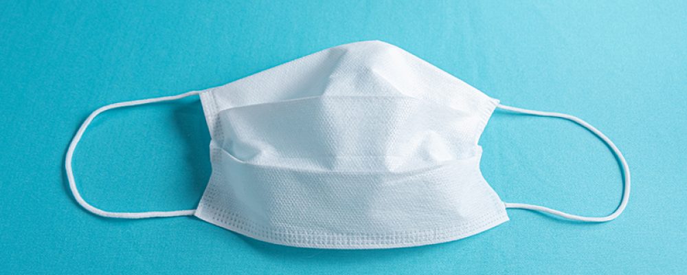 Surgical mascara over minimalist blue background